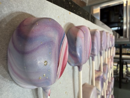 A fresh batch of marbled cake pops on the counter